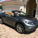 A Nissan Murano CrossCabriolet parked in front of a house